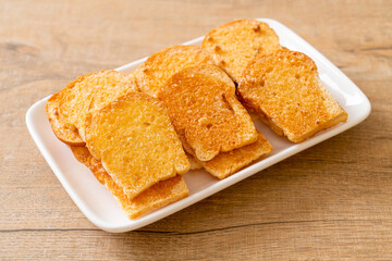 baked crispy bread with butter and sugar
