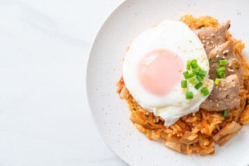 Kimchi fried rice with fried egg and pork