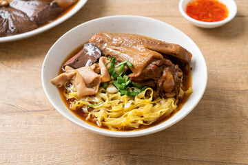 egg noodles with stewed and braised duck in brown soup