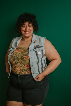 portrait of a plus size afro indigenous person looking at camera