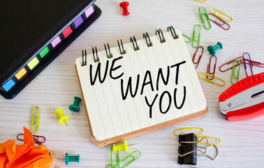 We want you symbol. Concept words We want you on white notebook. Beautiful wooden background. Business and We want you concept. Copy space.