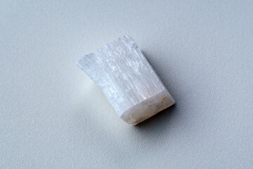 White selenite, variety of the mineral gypsum, zen meditation stones, white background