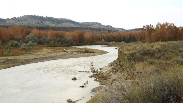 Muddy water flowing down Judith river in Montana