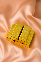 Gold bars on silk background. Business and finance concept. 