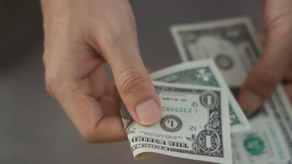 Close up of man  hand payment  by cash one dollar
