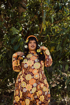 plus size Black woman with flowers in her hair