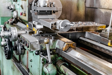 Close-up of lathe controls. Processing of metal products on a modern machine. Industrial processing of metal products with a cutting tool on an automatic lathe.