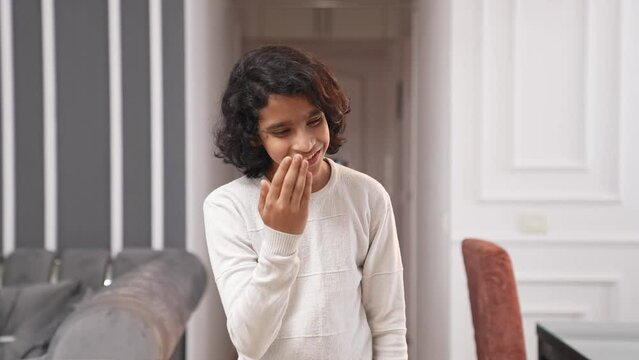Indian kid boy doing adaab for greetings