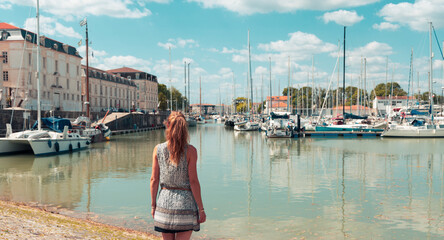 Woman tourist visiting Rochefort city and port- Charente Maritime in France