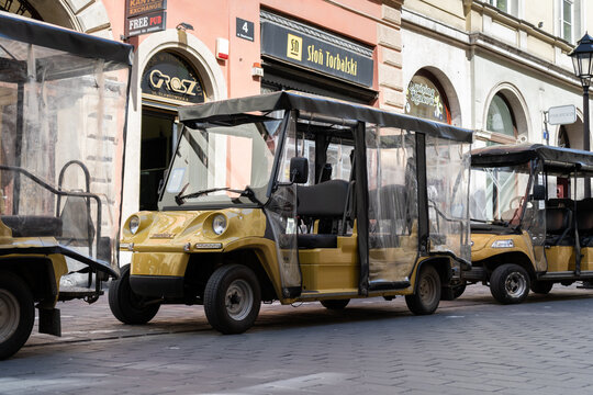 Krak&oacute;w city sightseeing tour by Melex electric car, with audio commentary. Tourist attraction of Cracow on May 5, 2023 in Krakow, Poland.