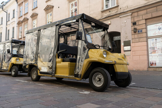 Krak&oacute;w city sightseeing tour by Melex electric car, with audio commentary. Tourist attraction of Cracow on May 5, 2023 in Krakow, Poland.