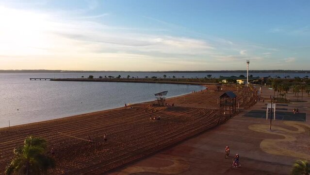 Circular Ariel shot over the beach overlooking the coastal area 