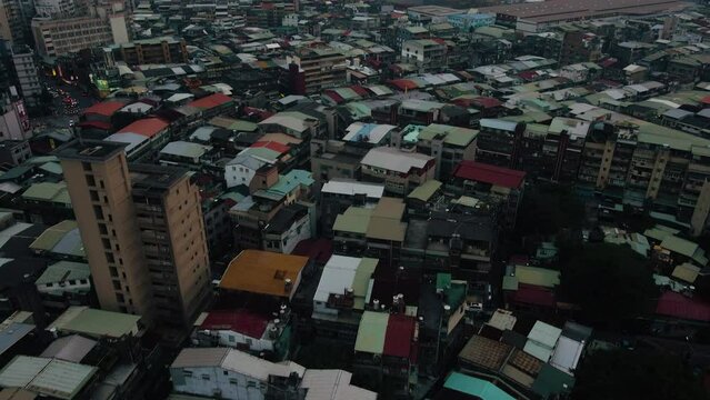Aerial View Of Wanhua Residential District In Taipei Taiwan. New Taipei City Skyline And Tamsui River Revealed In Cloudy Background. tilt-up