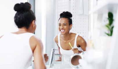 Woman check teeth in mirror, cleaning mouth with toothbrush and toothpaste, morning routine in...