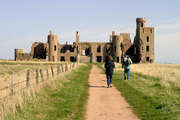 Walkers towards Slains Castle and Path - Aberdeenshire - Scotland - UK