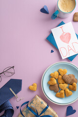 Fototapeta Father's Day treats from son: top vertical view of cookies, cocoa, hearts, glasses, necktie, postcard, and giftbox on lilac background with empty circle for text or ad obraz