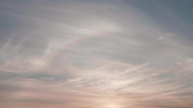 Sun halo phenomenon on the sky. Time lapse 4k footage of beautiful sunrise clouds.