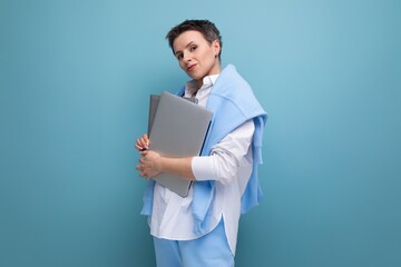 remote professions business concept. young woman holding a laptop in her hands