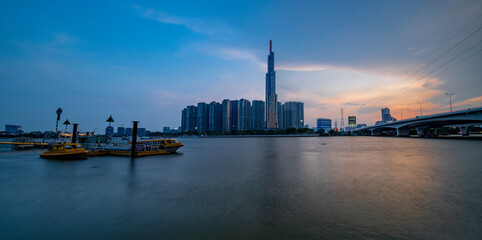 Naklejka premium Sunset on Saigon riverside, Ho Chi Minh city Vietnam. Photo taken on May 2023