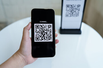 Qr code payment. E wallet. Man scanning tag accepted generate digital pay without money.scanning QR code online shopping cashless payment and verification technology concept.