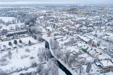 Obraz premium Suwalki, Poland - winter drone aerial photo - citycape, snowy landscape, cloudy moody day