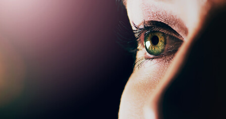 Woman, face and closeup of eye on mockup space for vision or sight against a dark background. Female person with eyelashes and green or hazel eyes looking in perception, eyesight or light on mock up - obrazy, fototapety, plakaty