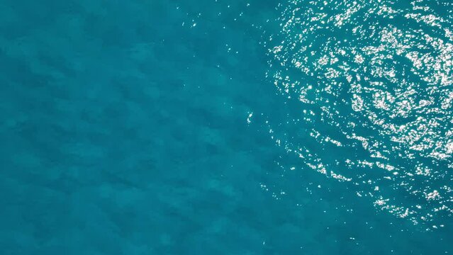 Aerial top down view of sea surface water, static shot