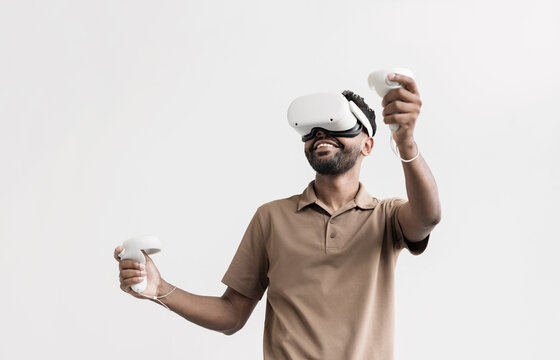 Young man using virtual reality headset at home, VR, future gadgets, technology, virtual event, education, study, learning, video game concept.