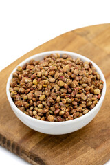 Sumac seeds. Dried sumac berries isolated on white background. Spice concept. Close up