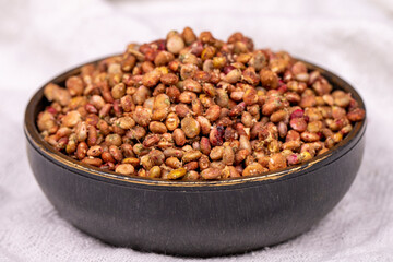 Sumac seeds. Dried sumac berries on white background. Spice concept. Close up