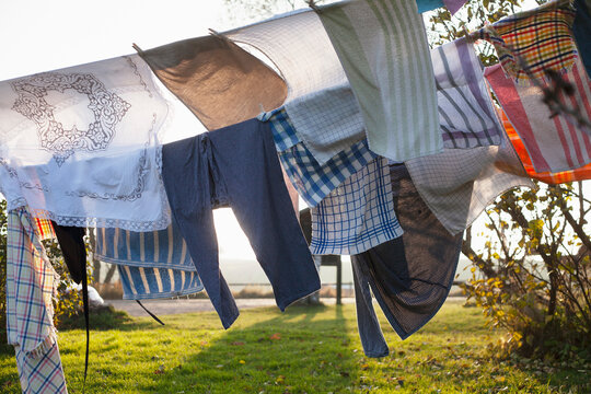 Windblown clothes on clothesline at sunset
