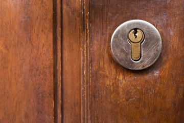 Closeup keyhole on wooden door