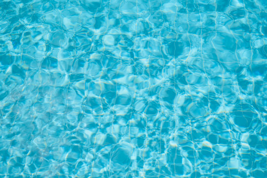 blue pool surface, swimming pool water background, idea for background or screen, vacation and vacation.