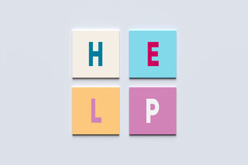 Support and help concept. The word help on colorful square blocks.