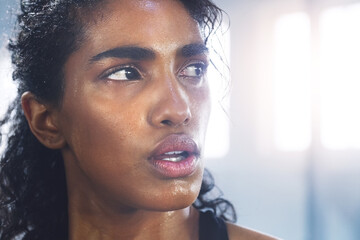 Sweating, woman and breathing while taking a break from fitness, exercise and workout. Gym, Indian...
