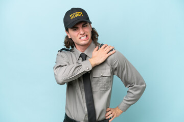 Young safeguard man isolated on blue background suffering from pain in shoulder for having made an...