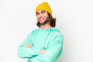 Young handsome man isolated on white chroma background with arms crossed and looking forward