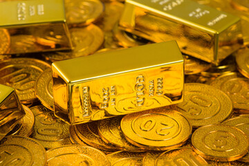 gold bars, gold coins and dollar background.