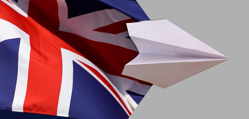 The plane over the flag of great Britain, the concept of travel. Toy plane, tourism and travel