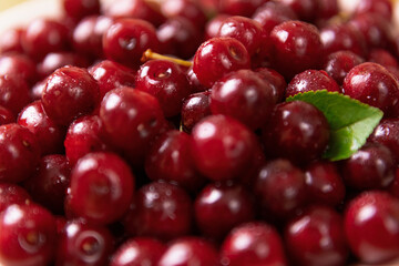 Sweet cherry macro photography close up. Antioxidant, natural, organic, vitamin berry. Selective focus. Drops of water on the surface of berries. Macro background. Top view, shallow focus