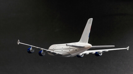 Fototapeta na wymiar Model plane, airplane on dark background.