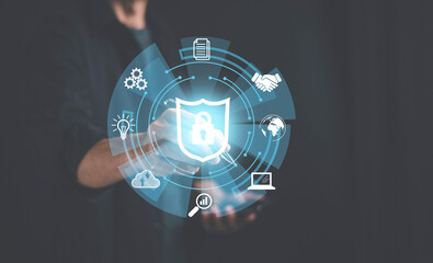 A man is writing action behind the shield protect security icon on network ; security on the virtual display.Information security system.Cyber security safe data protection. Cool tone.