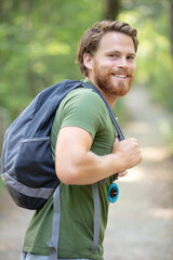 young man hiking smiling happy portrait