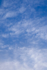 wallpaper, stretch ceiling or Beautiful white clouds on deep blue sky background. Elegant blue sky picture in daylight. Small thin soft white fluffy clouds in the blue sky background. No focus