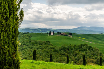 View on the Vitaleta Chapel and the surrounding hills of the Orcia Valley near San Quirico d'Orcia