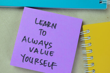 Concept of Learn To Always Value Yourself write on sticky notes isolated on Wooden Table.
