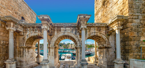 Naklejka premium Welcome to the magnificent Antalya concept. Collage of famous landmarks: Hadrian's Gate old town Kaleici district and Konyaaltı beach popular holiday destination in Antalya, Turkey