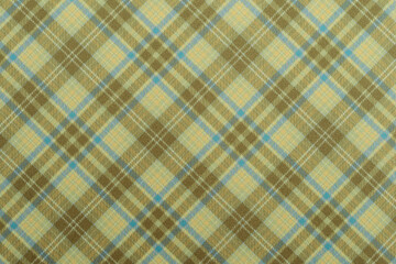 Christmas blue green checkered background, texture seamless pattern fabric checkered, gingham backdrop. Plain classic Scottish plaid design. Suitable for jackets, flannel textile. top view of table.