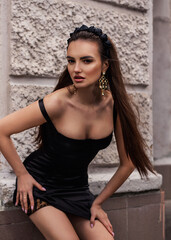 a woman in a Sicilian Italian look in a black dress