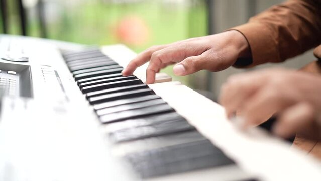 Playing Piano Close-up Shot with green background